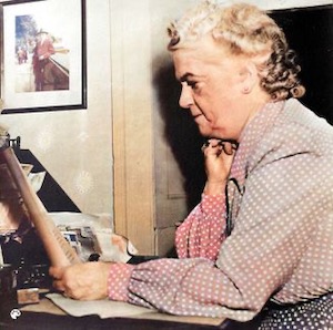 Colorized Emilie Loring at her desk