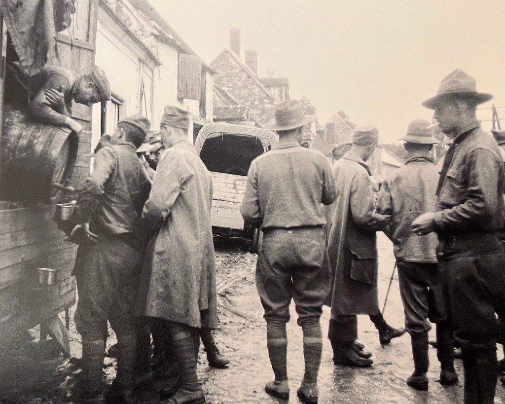 Soldiers in line for drink, WWI France

