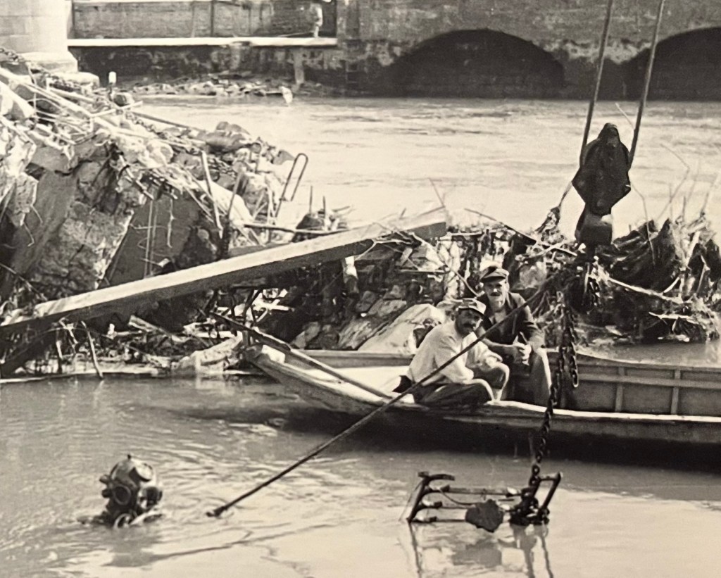 Scuba diver in wreckage of bridge, France, WWI